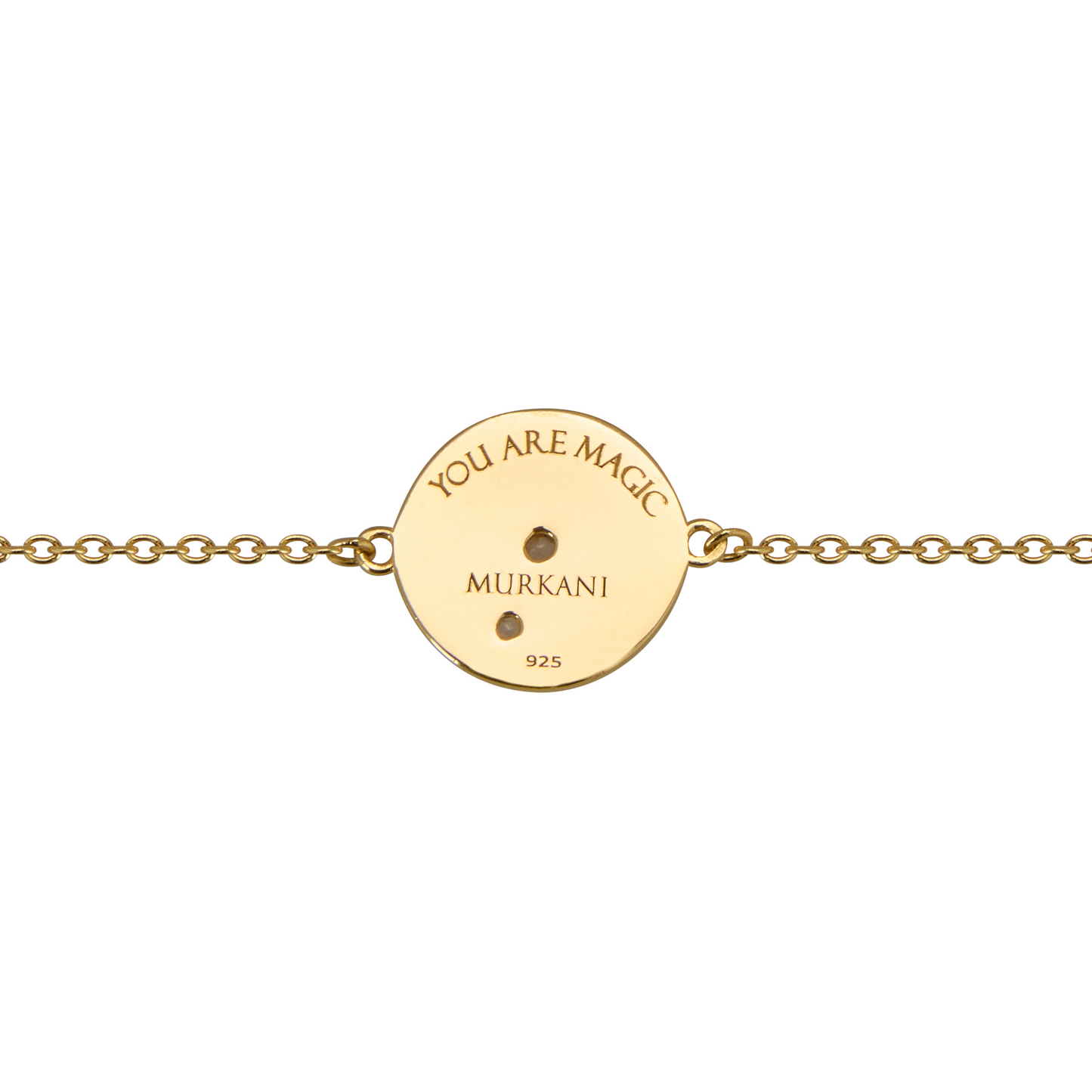 Gold bracelet with a round engraved disc on a white background