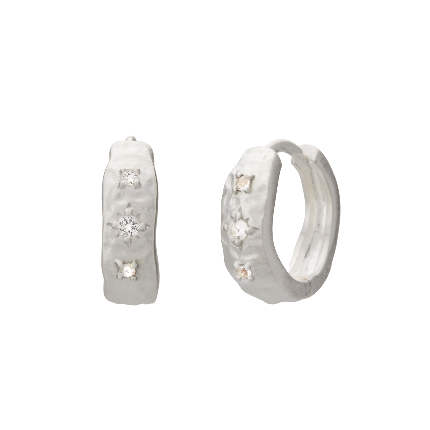 Silver hoop earrings with embedded stones on a white background