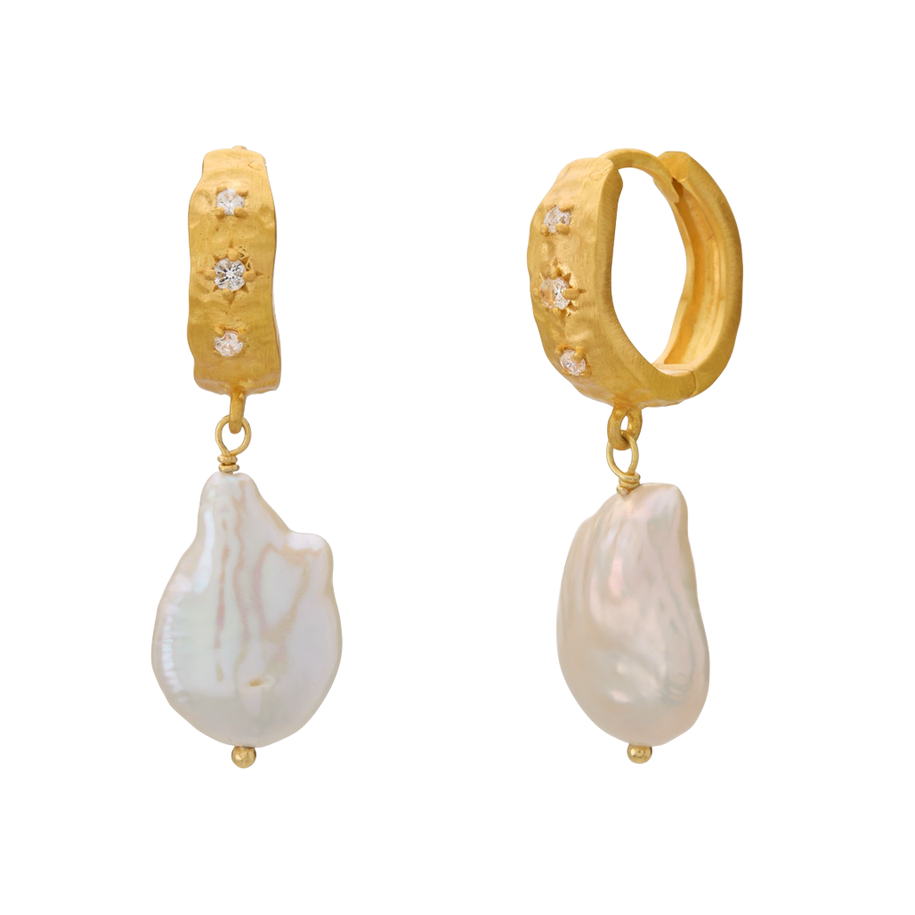 Gold hoop earrings with pearl drops on a white background