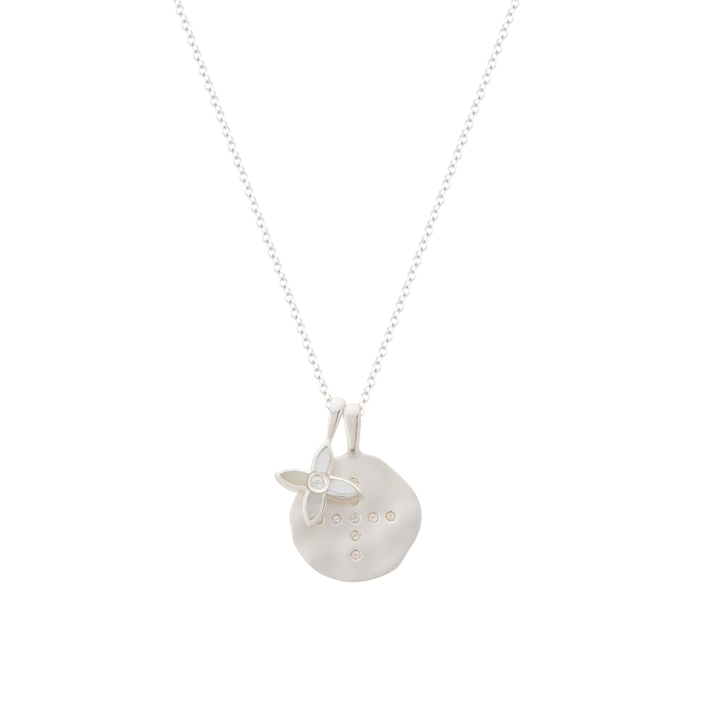 Silver necklace with a round pendant on a white background
