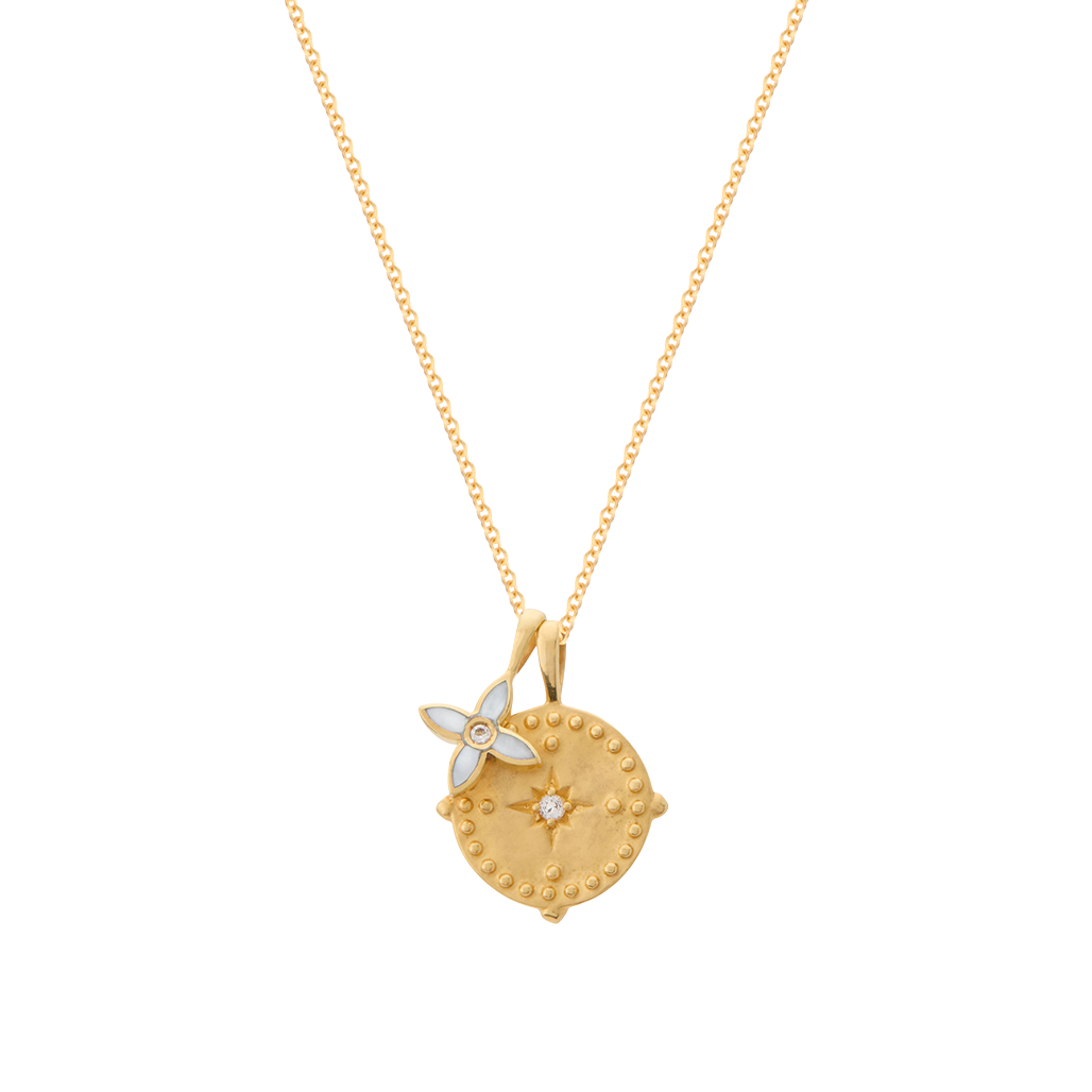 Gold necklace with a decorative pendant on a white background