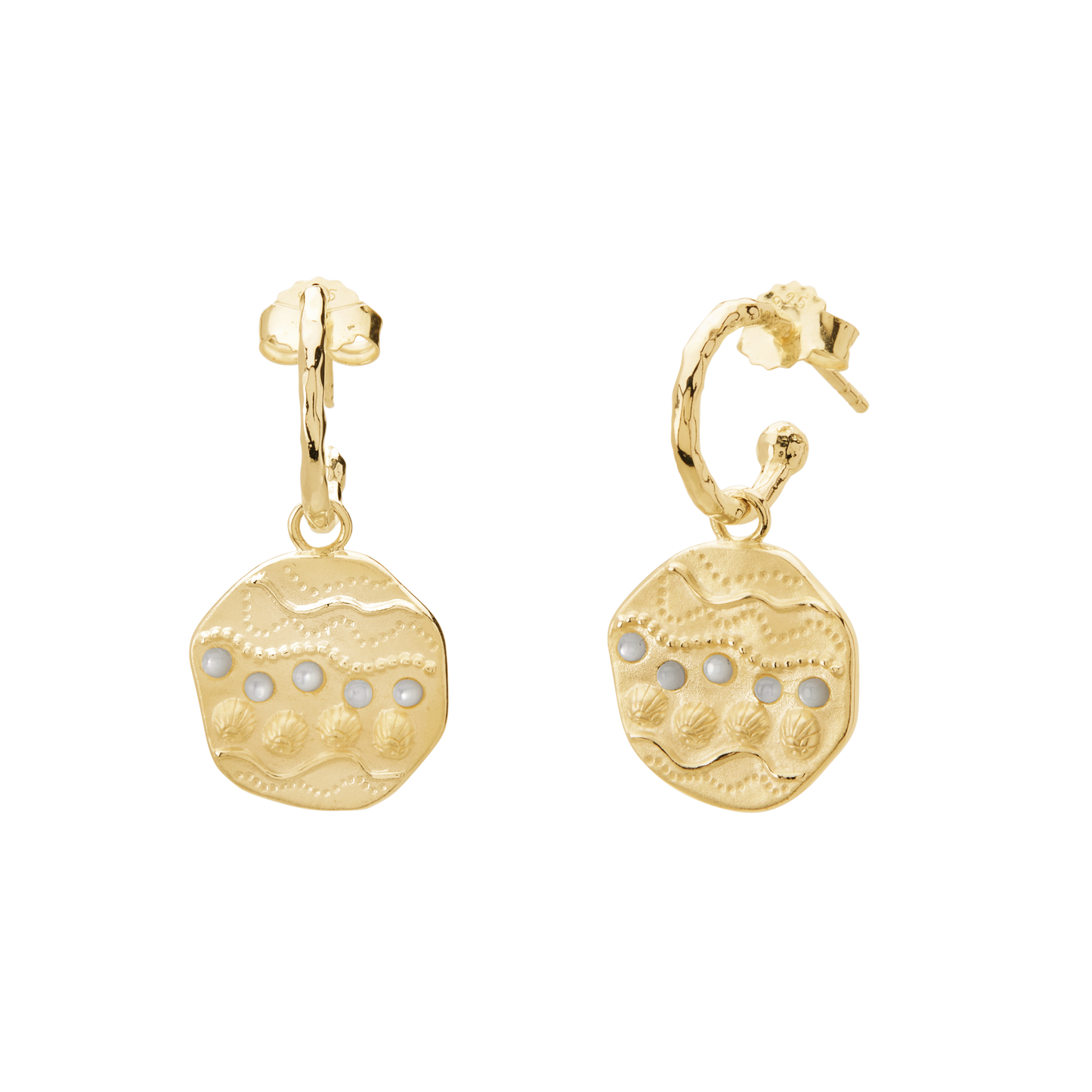 Gold earrings with circular designs on a white background
