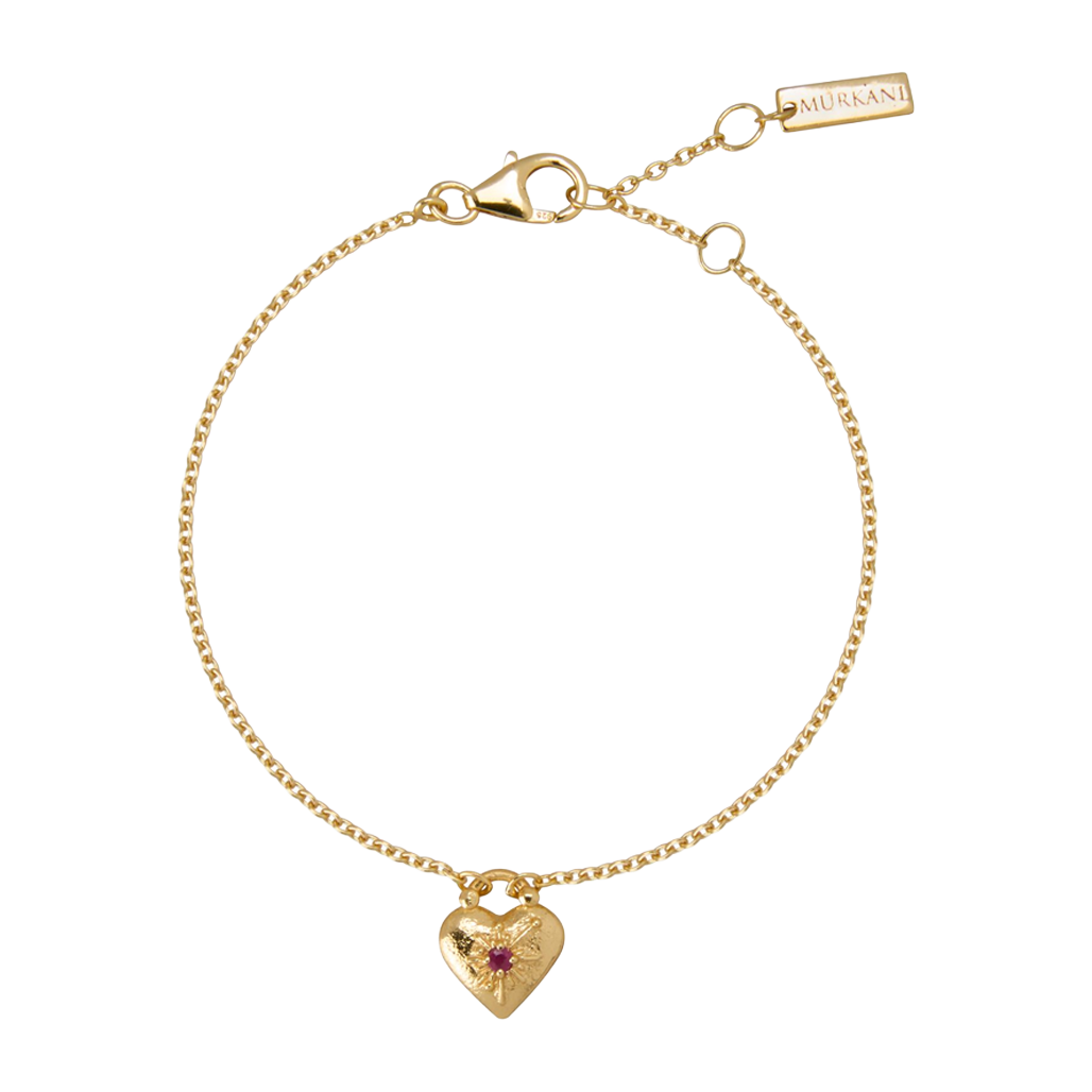 Gold bracelet with a heart-shaped charm on a white background