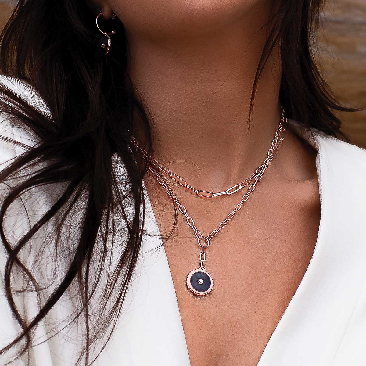 Rose gold drop necklace with meaningful ancient symbolism and black onyx gemstones, artisan-made and ethically produced.