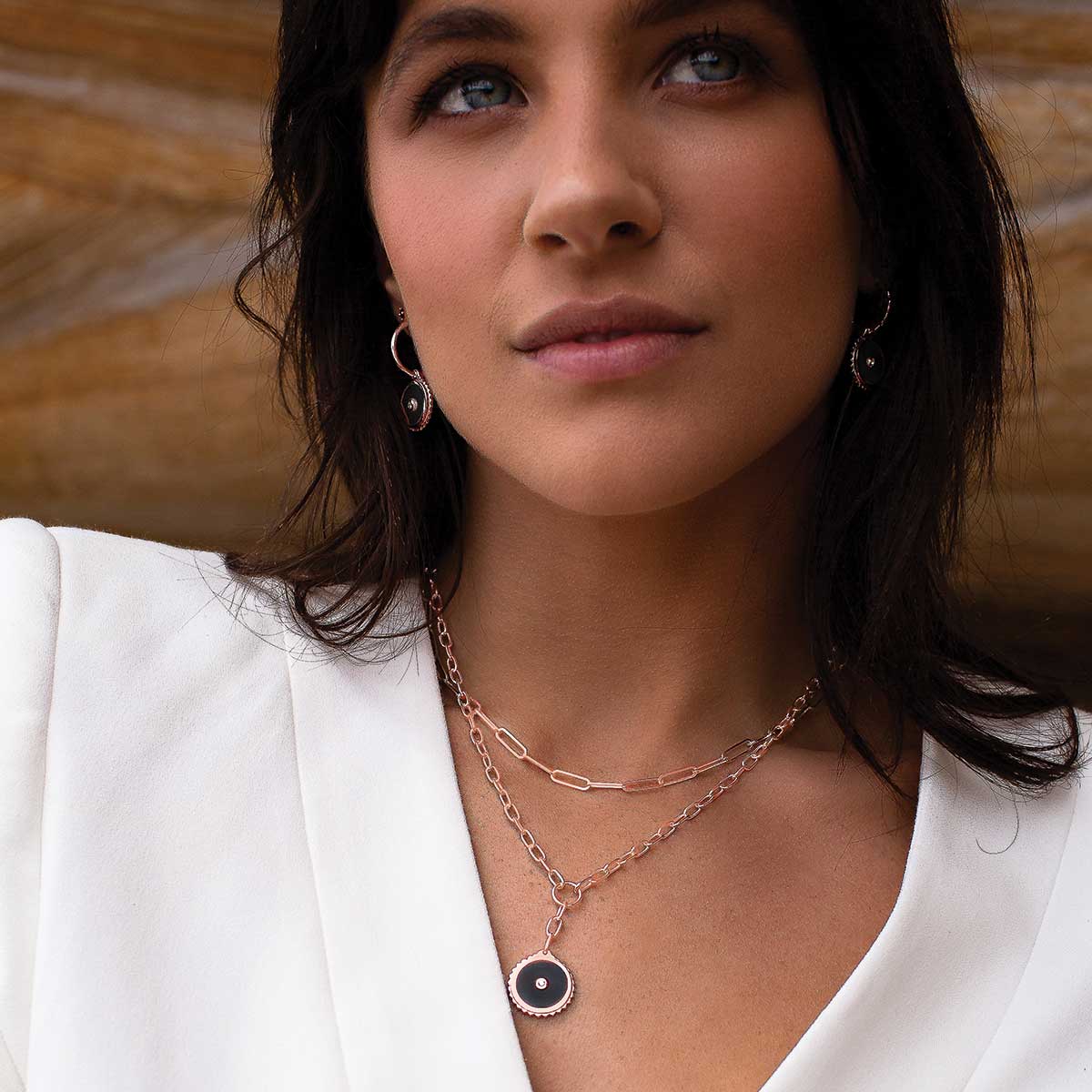 Rose gold drop necklace with meaningful ancient symbolism and black onyx gemstones, artisan-made and ethically produced.