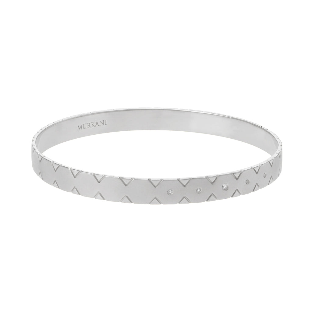Make a statement with this modern sterling silver bangle featuring Celtic symbolism inspired by ancient jewellery. 