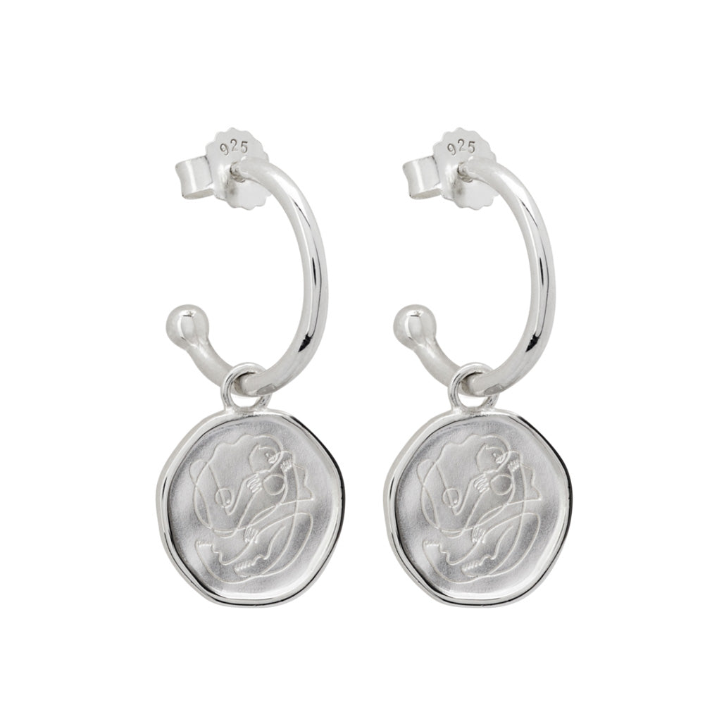 Handcrafted Sterling Silver hoop earrings celebrates the bond between mother and child. Artisan-made and intricately designed.