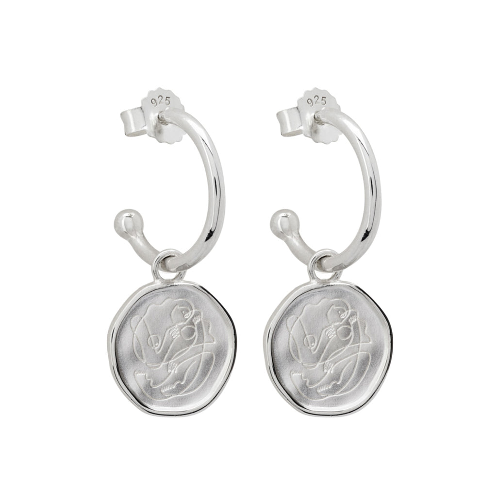 Handcrafted Sterling Silver hoop earrings celebrates the bond between mother and child. Artisan-made and intricately designed. 