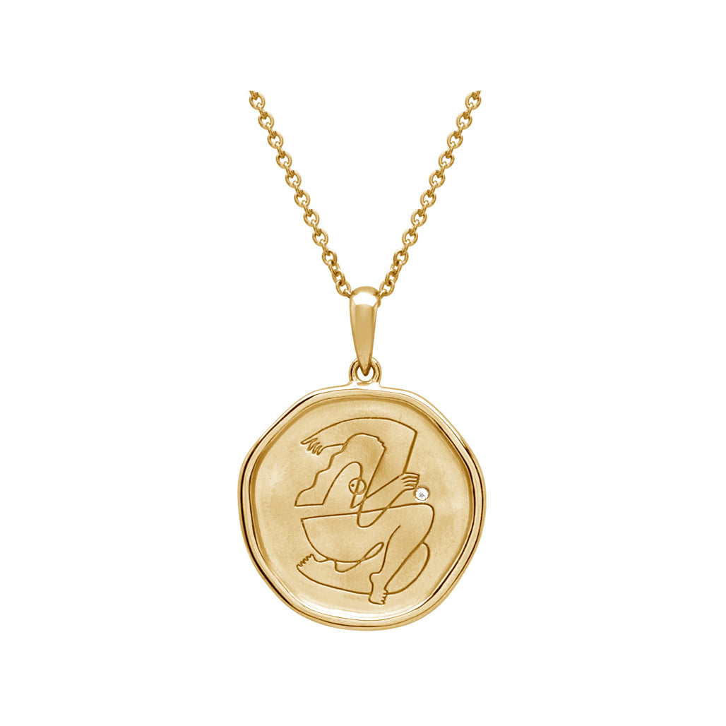 Gold empowerment necklace, meticulously handcrafted by an artisan, showcasing intricate craftsmanship and attention to detail.