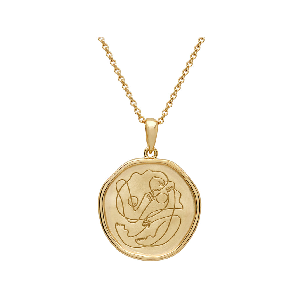 Handcrafted gold necklace celebrates the bond between mother and child. Artisan-made and intricately designed.