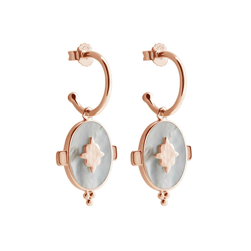 Handcrafted hoop earrings featuring luminous mother of pearl pendant. Crafted by skilled artisans.