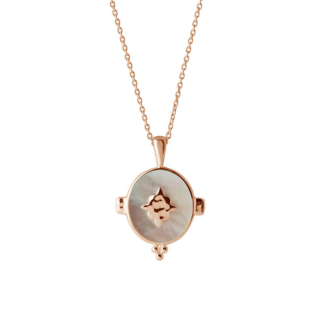 A handcrafted necklace featuring a mother of pearl pendant in a rose gold setting. An Artisan-made piece of jewellery.