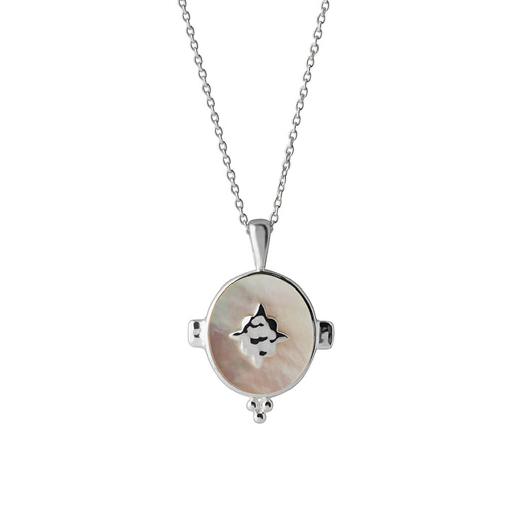 A handcrafted necklace featuring a mother of pearl pendant in a sterling silver setting. An Artisan-made piece of jewellery.