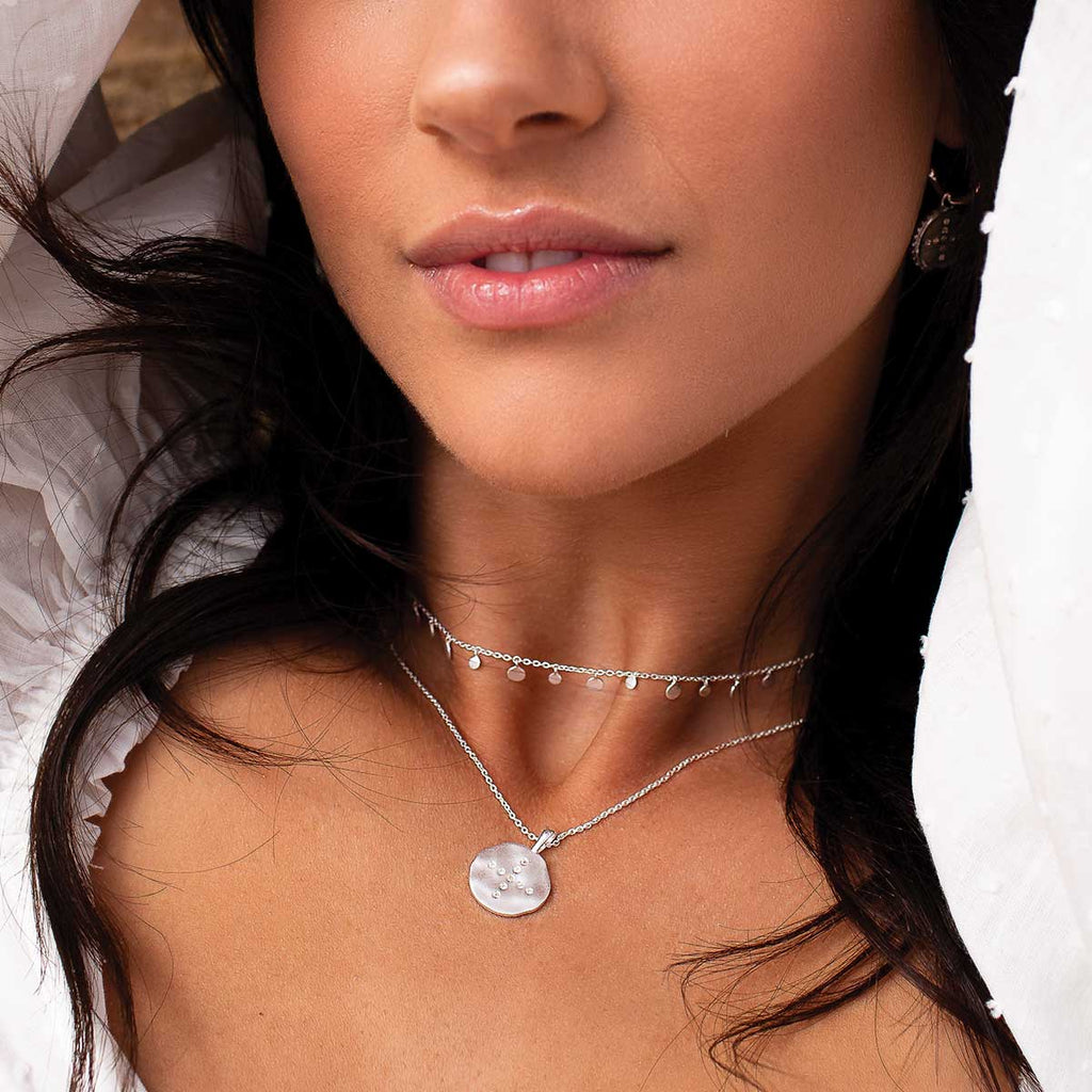 Handcrafted sterling silver necklace with white topaz gemstones. Artisan-made with natural and long-lasting materials.