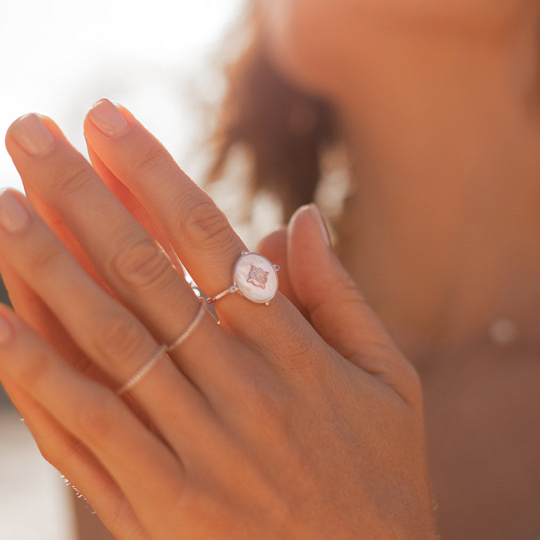 Handcrafted ring, created by skilled artisans. Featuring mother of pearl centrepiece, delicately set in a lustrous rose gold band.