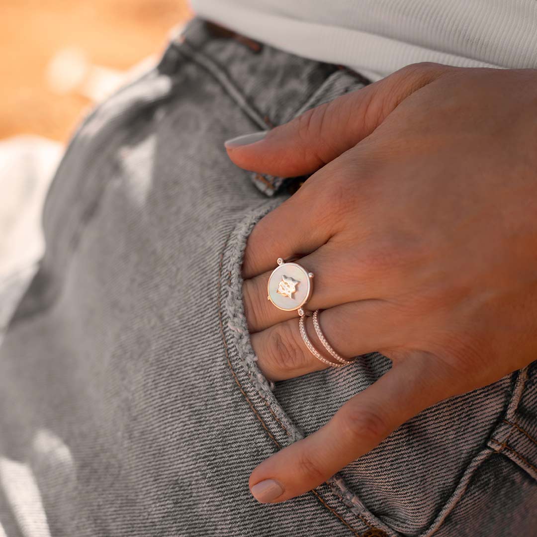 Handcrafted ring, created by skilled artisans. Featuring mother of pearl centrepiece, delicately set in a lustrous sterling silver band.