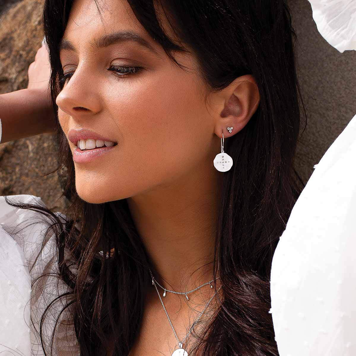 Ethically made artisan sterling silver hoop earrings with ancient symbolic meaning, inspiring confidence, and bravery.