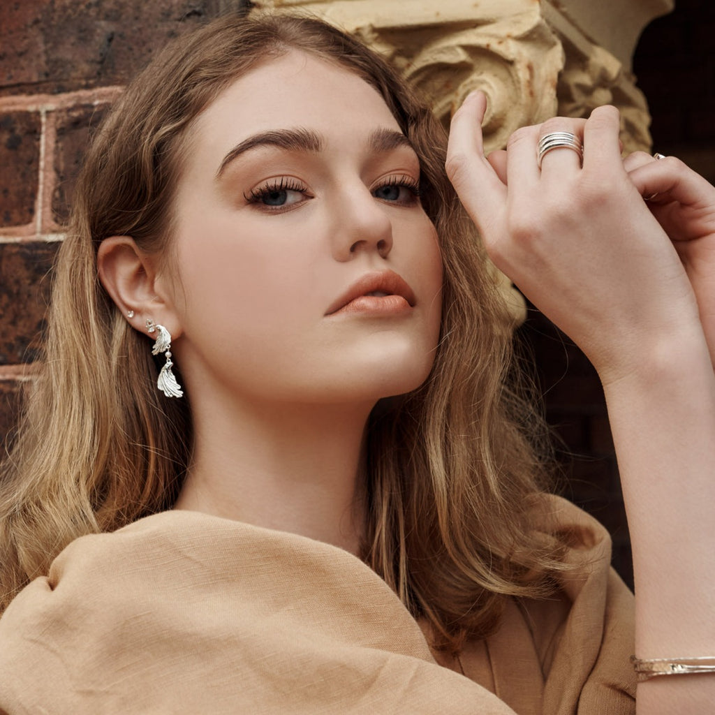 Modern earrings feature a textural aesthetic, evoking a sense of nostalgia. Inspired by love letters and ancient jewellery.