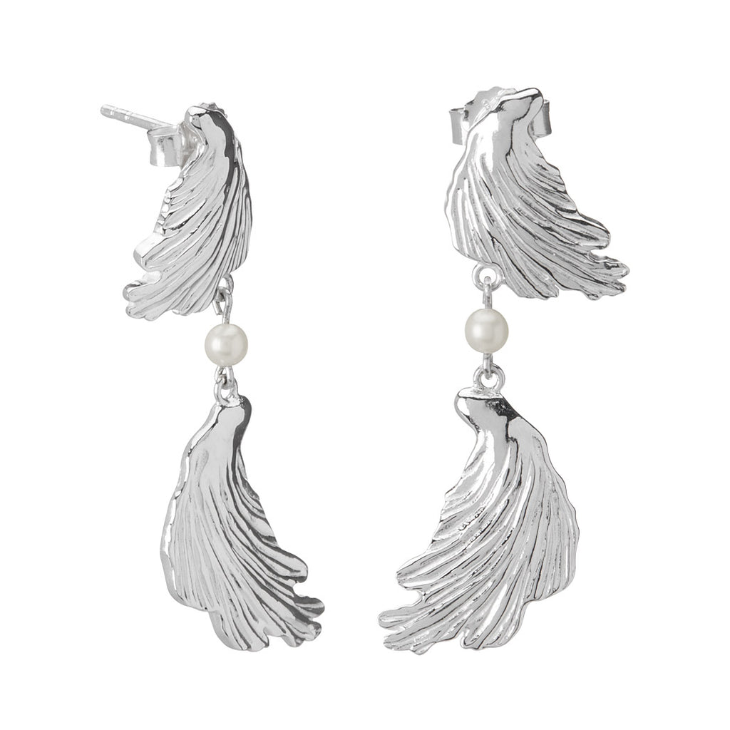 Modern earrings feature a textural aesthetic, evoking a sense of nostalgia. Inspired by love letters and ancient jewellery.