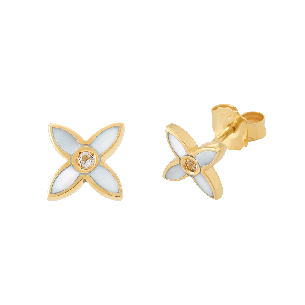 Gold and white flower-shaped earrings on a white background