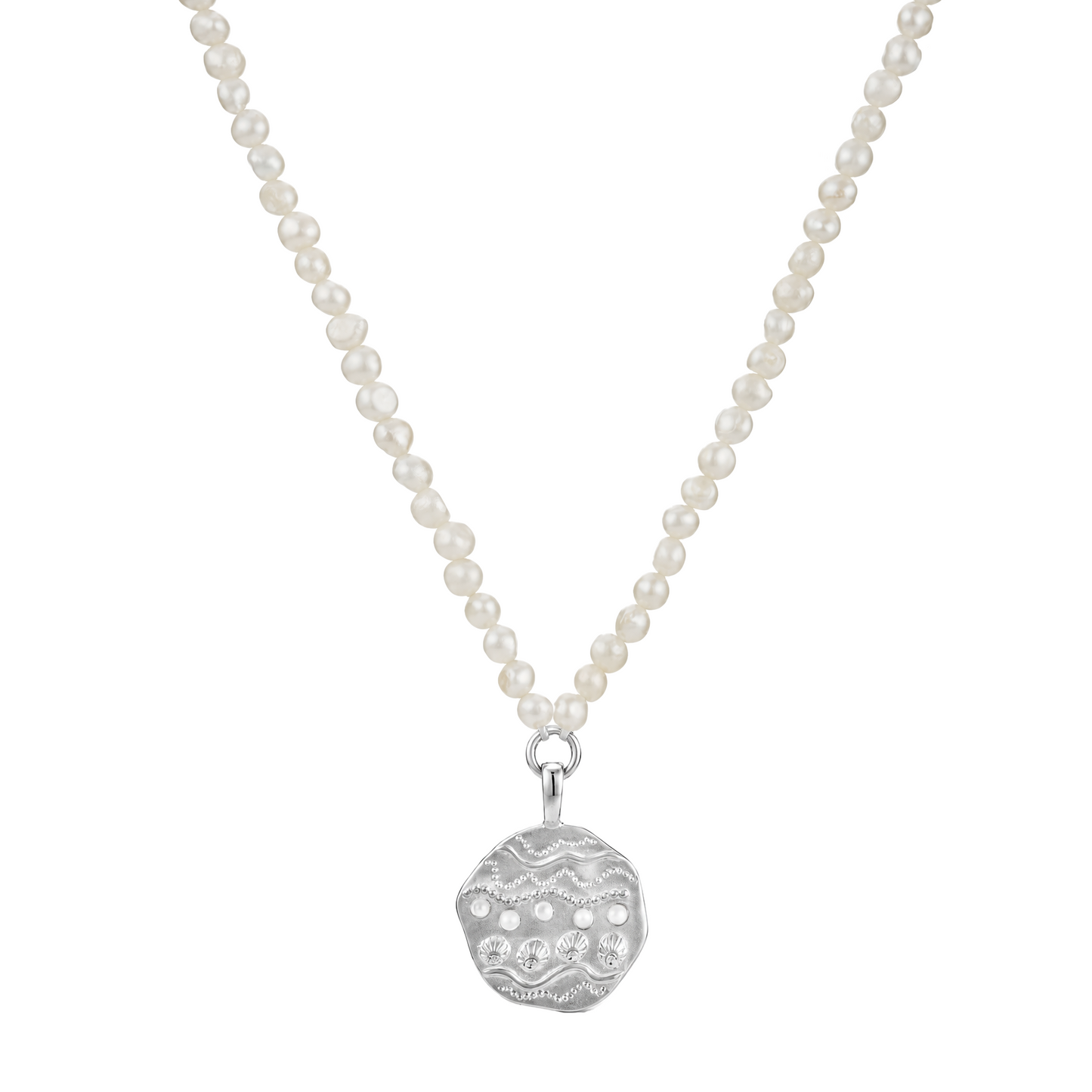 A necklace featuring a strand of small, round off-white pearls suspended from a silver-toned chain, ending in a textured silver pendant with small clear stones, shown against a plain white background.