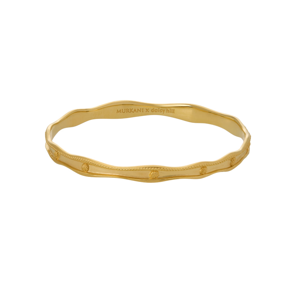 Gold bracelet on a white background