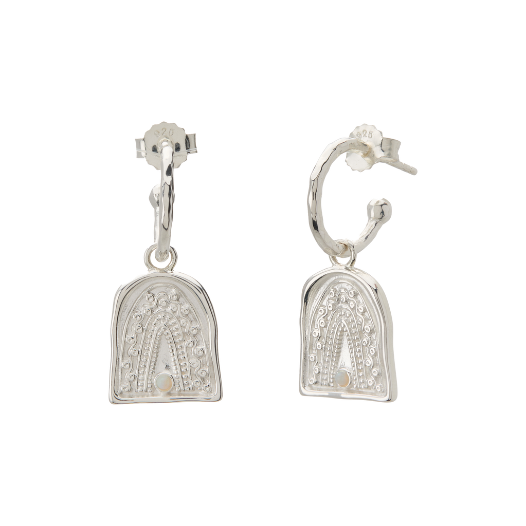 Pair of silver earrings on a white background