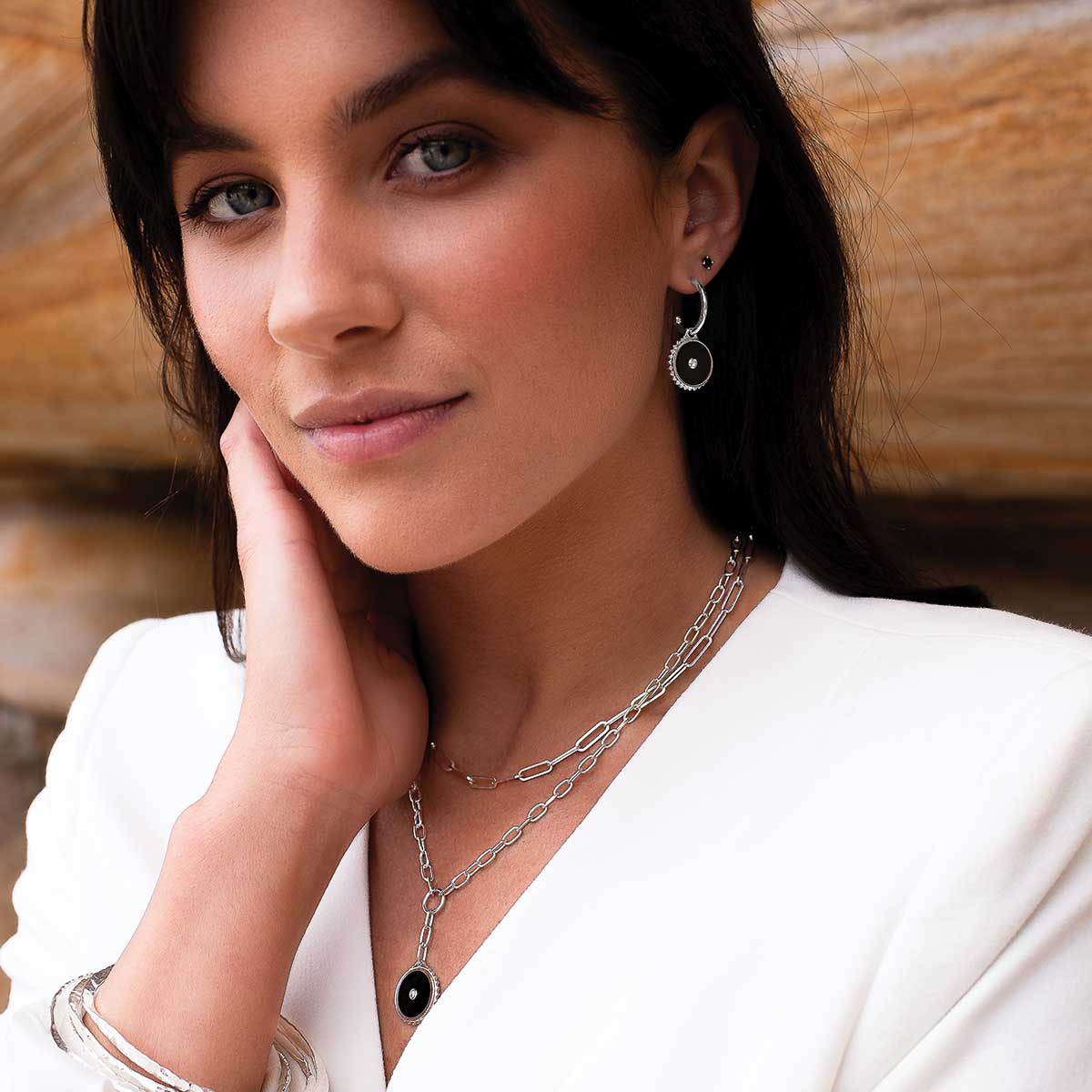 Sterling silver hoop earrings with black onyx and white topaz. Feminine Celtic design with meaningful ancient symbolism.