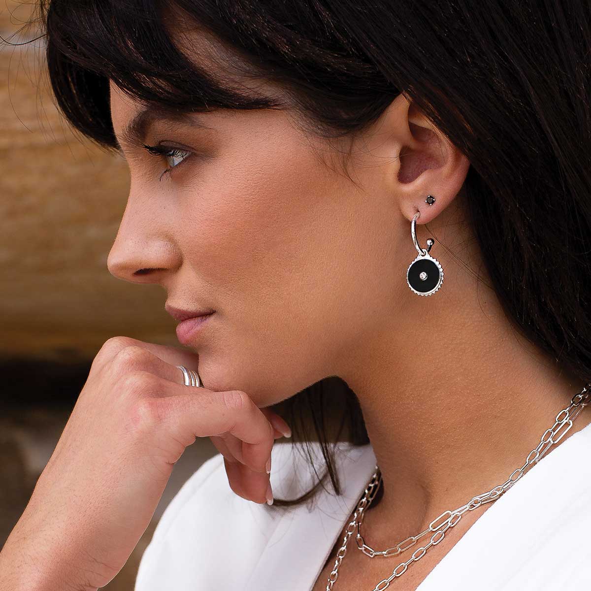 Sterling silver hoop earrings with black onyx and white topaz. Feminine Celtic design with meaningful ancient symbolism.