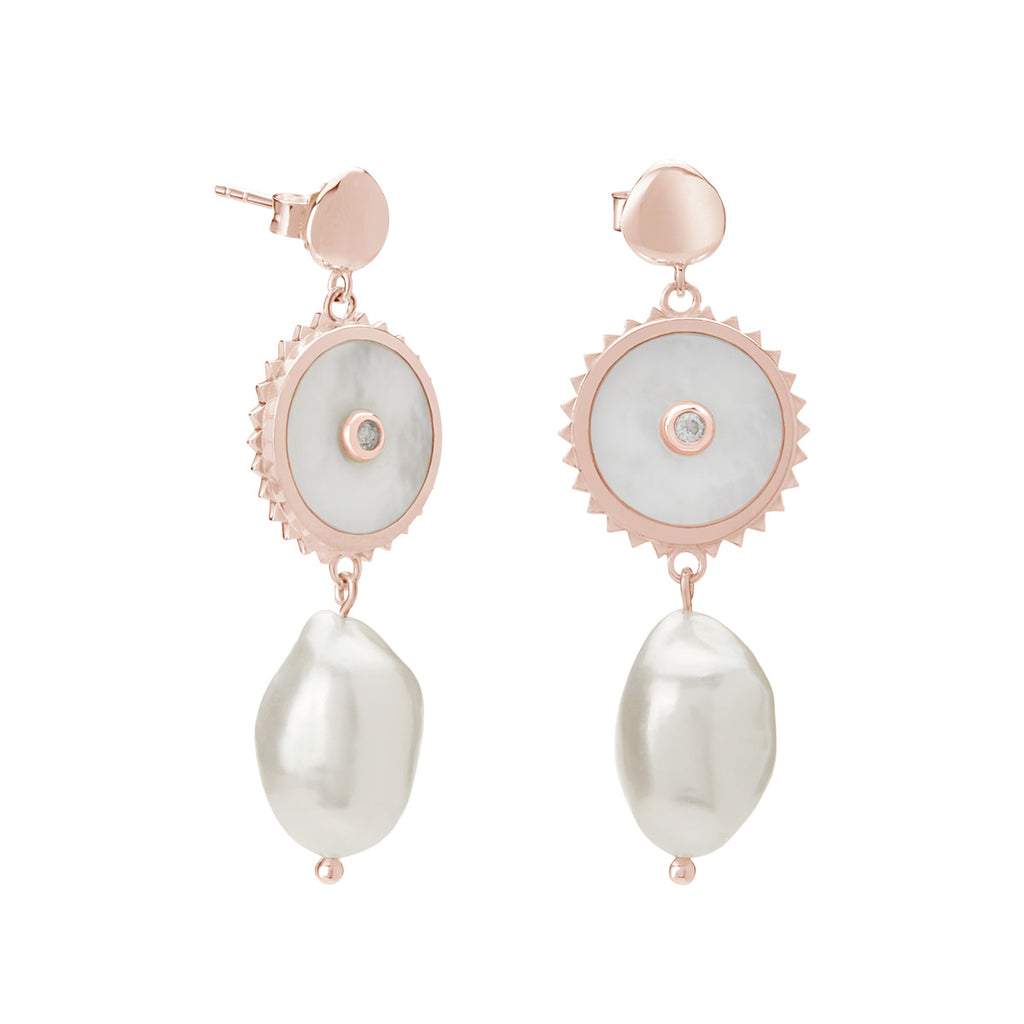 Handcrafted artisan-made rose gold pearl earrings. Produced in small batches using natural materials.