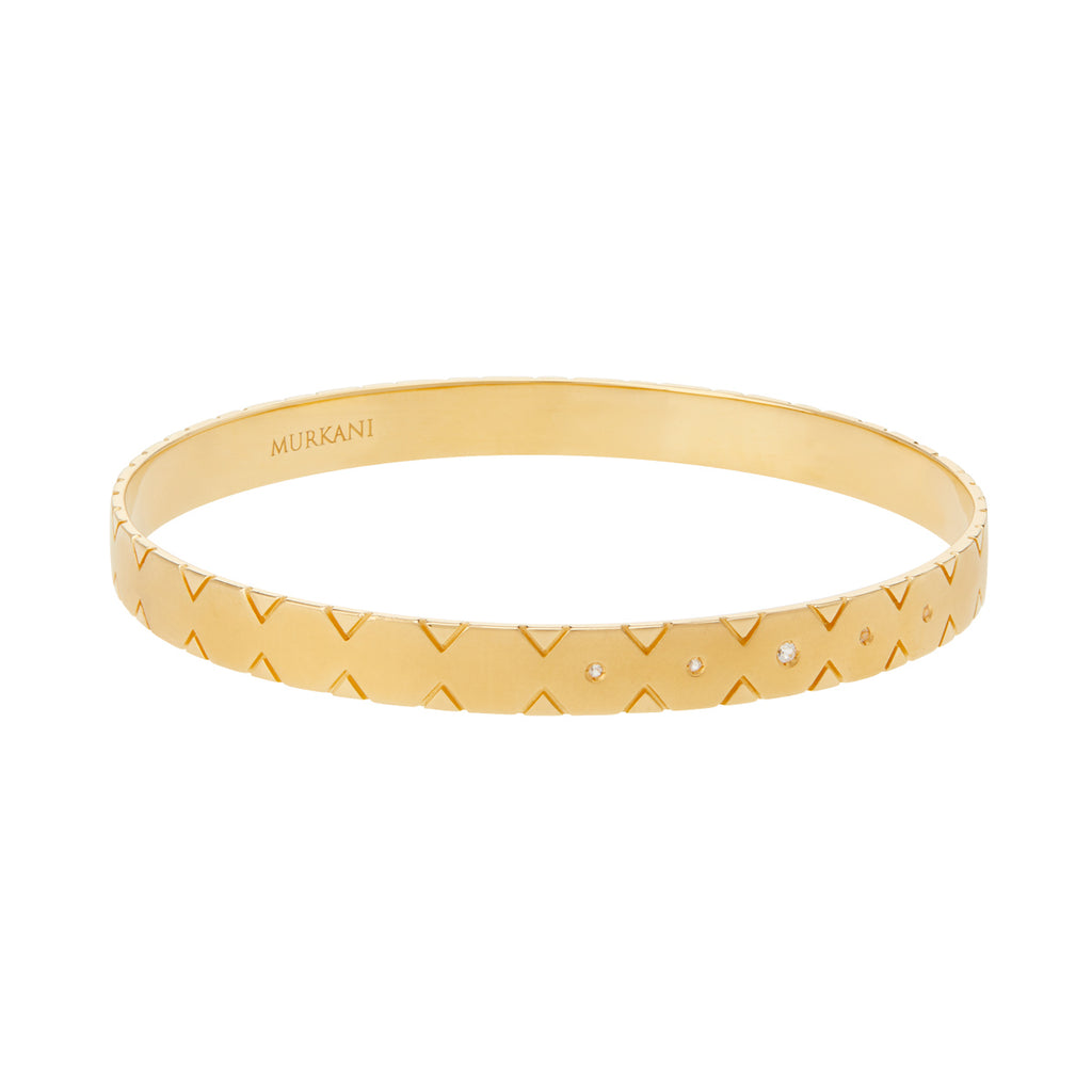 Modern gold bangle with Celtic symbolism, perfect for stacking and making a statement. Inspired by ancient symbolism. 