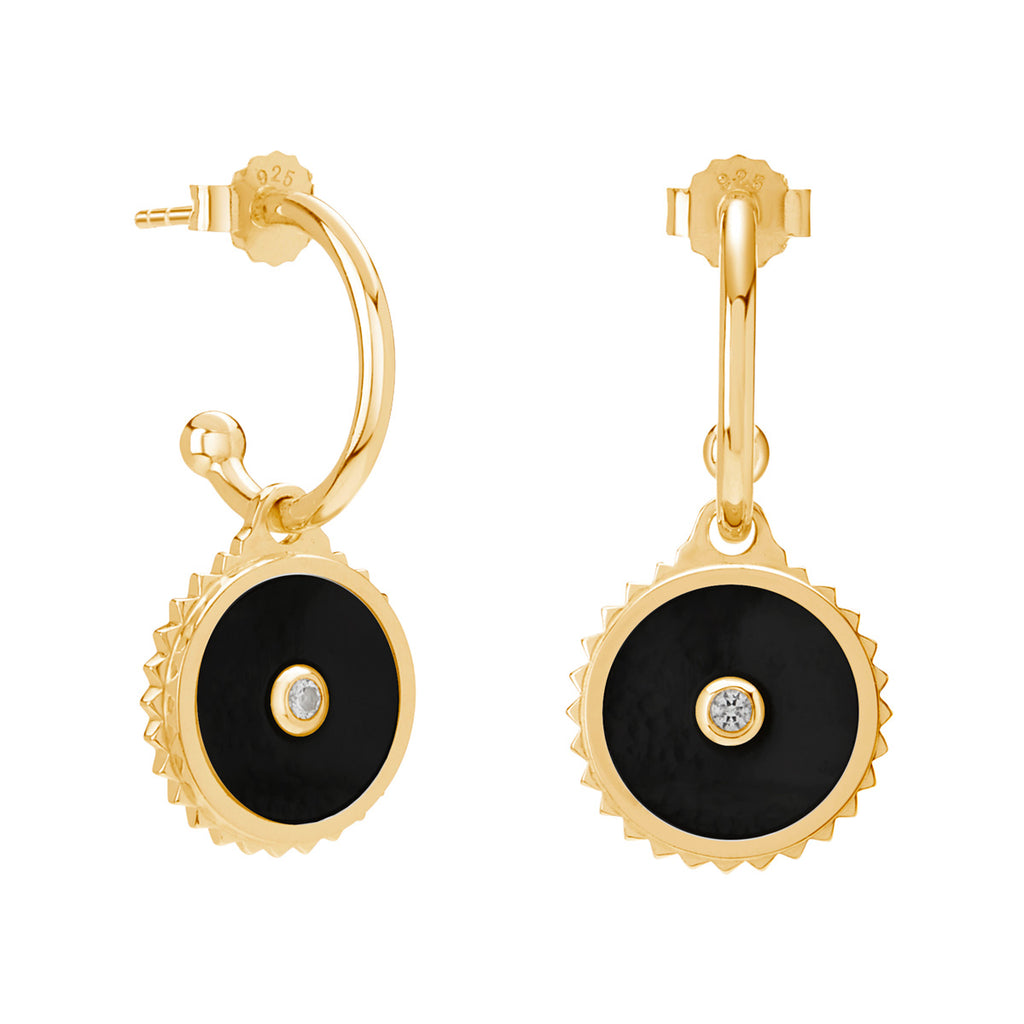 Handcrafted yellow gold hoop earrings with black onyx and Celtic-inspired design. Symbolic of ancient talismans.