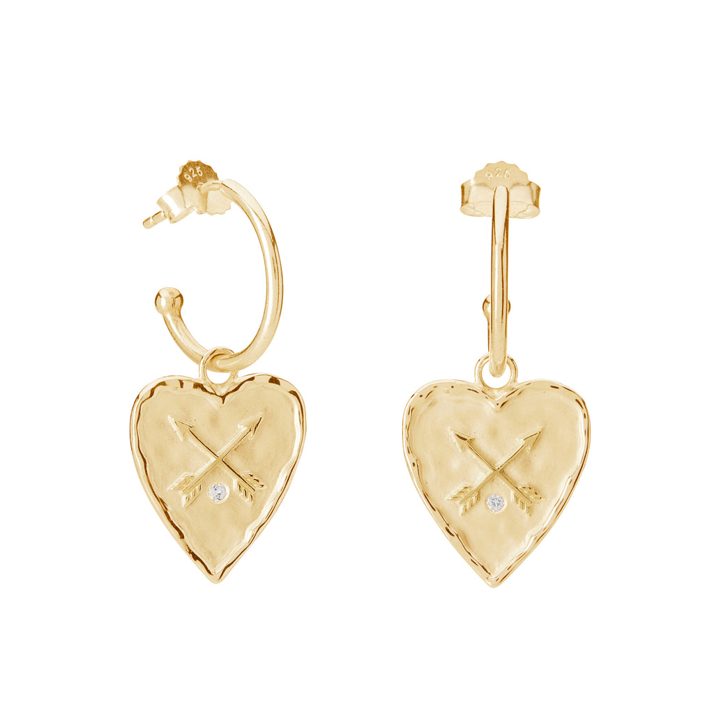 Handcrafted gold statement earrings symbolising love, heart friendships, and ancient symbolism; meaningful heirloom jewellery.