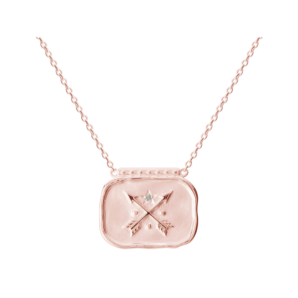 Pendant necklace, handcrafted with ancient symbolism in rose gold. Artisan-made jewellery featuring crossed arrows.