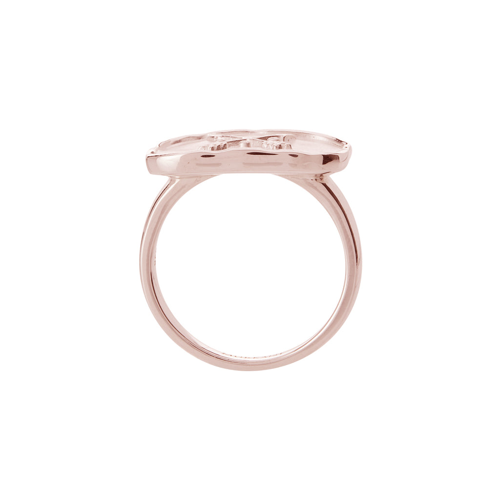 Handcrafted statement ring in rose gold with ancient symbolism. Artisan-made with a crossed arrow design. 