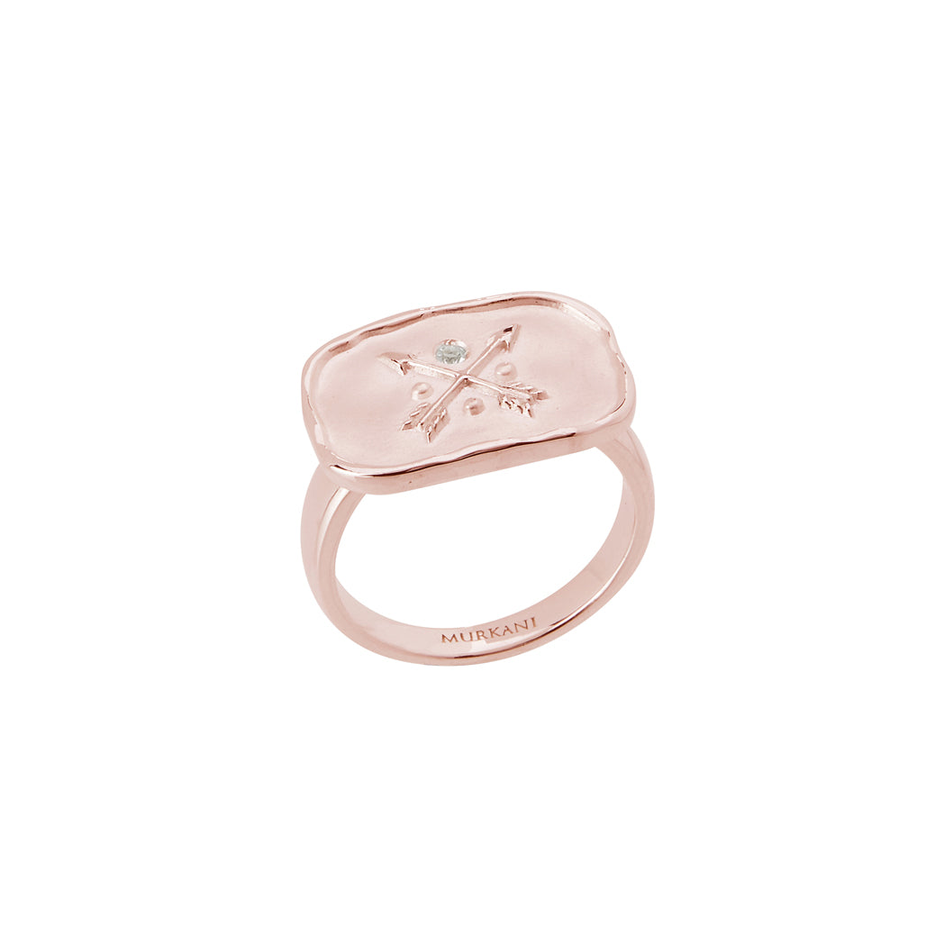 Handcrafted statement ring in rose gold with ancient symbolism. Artisan-made with a crossed arrow design. 