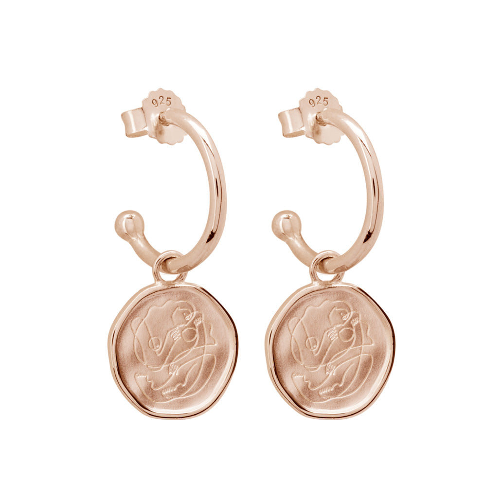 Handcrafted Rose Gold hoop earrings celebrates the bond between mother and child. Artisan-made and intricately designed. 