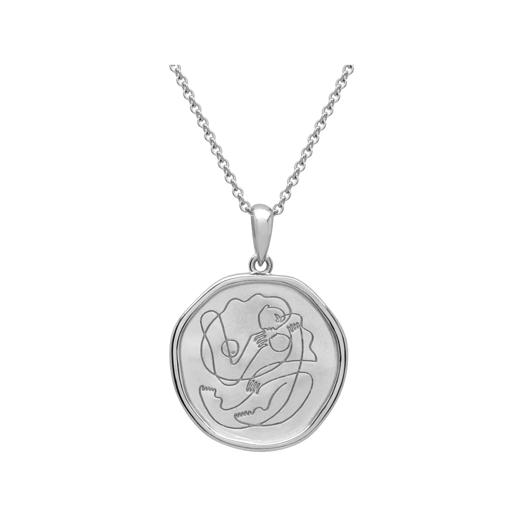 Handcrafted Sterling Silver necklace celebrates the bond between mother and child. Artisan-made and intricately designed. 