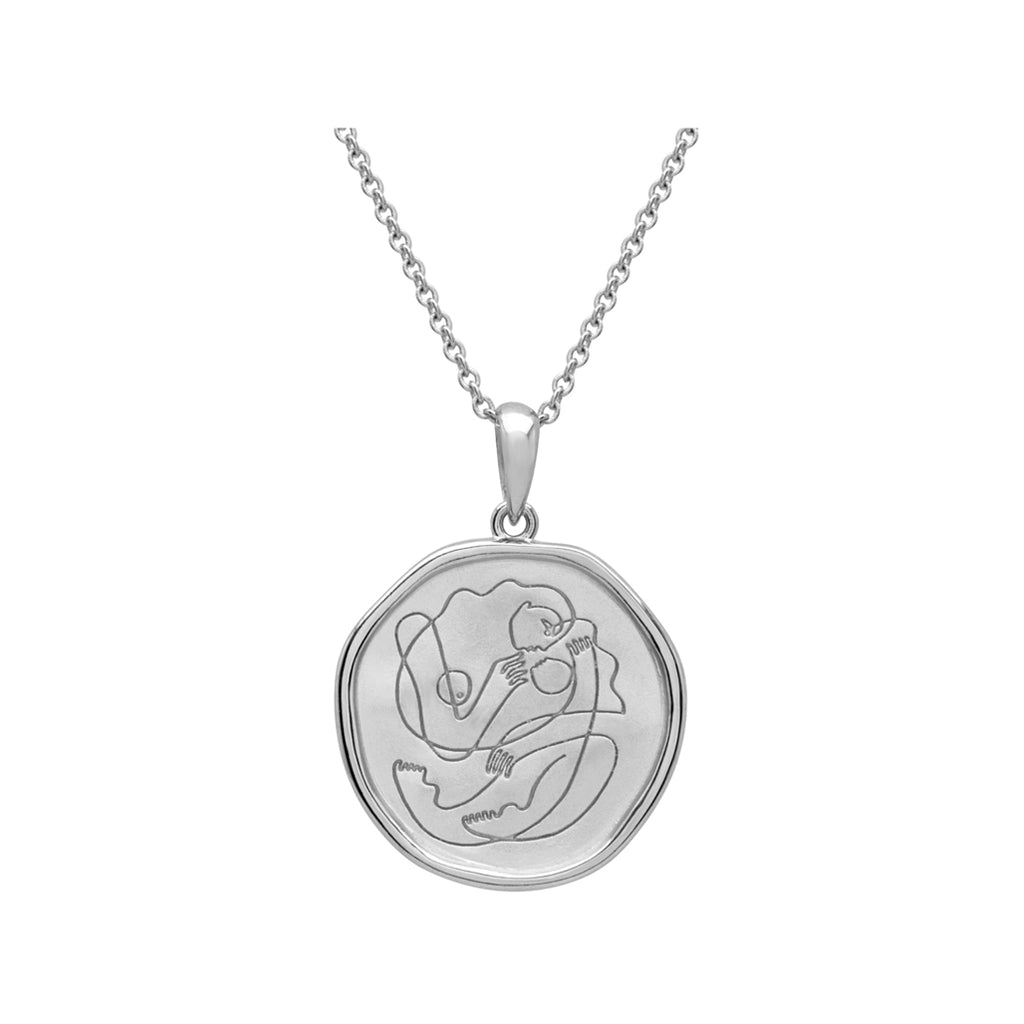 Handcrafted Sterling Silver necklace celebrates the bond between mother and child. Artisan-made and intricately designed. 