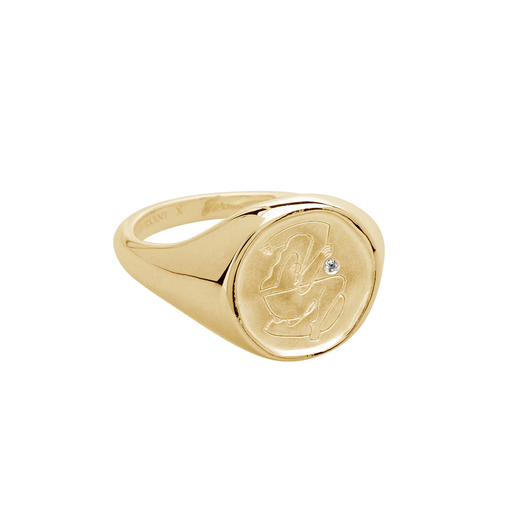 Gold empowerment ring, handcrafted by an artisan, showcasing intricate craftsmanship and attention to detail.