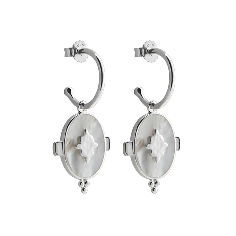 Handcrafted hoop earrings featuring luminous mother of pearl pendant. Crafted by skilled artisans. 