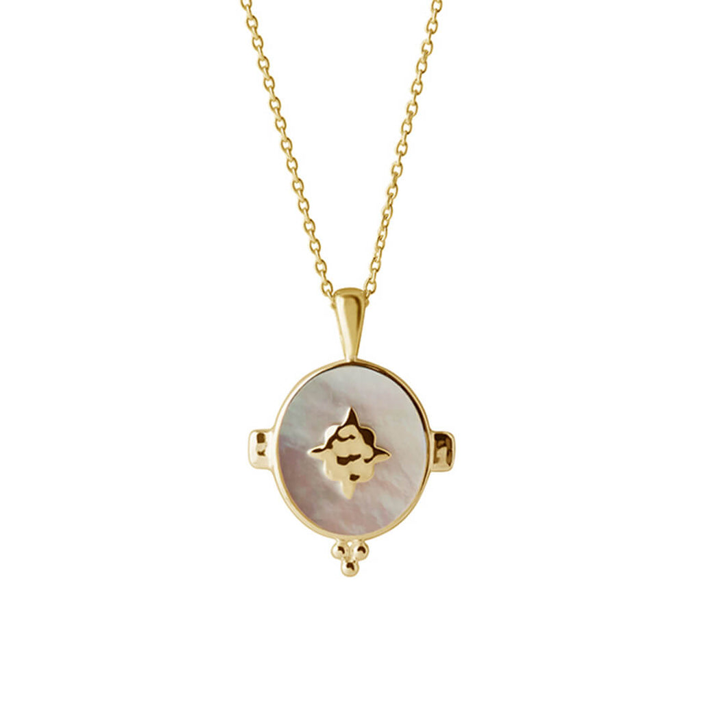A handcrafted necklace featuring a mother of pearl pendant in a yellow gold setting. An Artisan-made piece of jewellery.