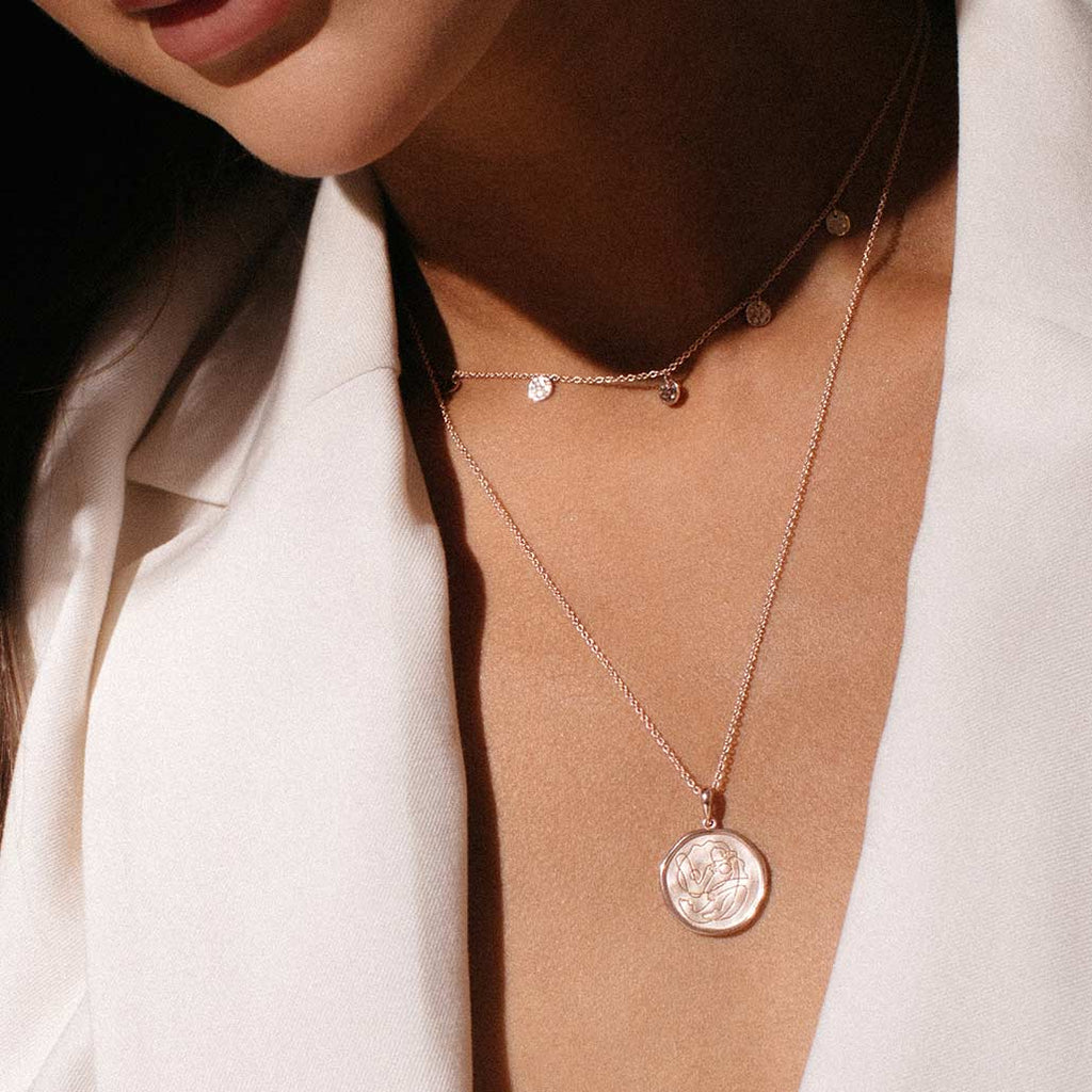 Handcrafted Rose Gold necklace celebrates the bond between mother and child. Artisan-made and intricately designed. 