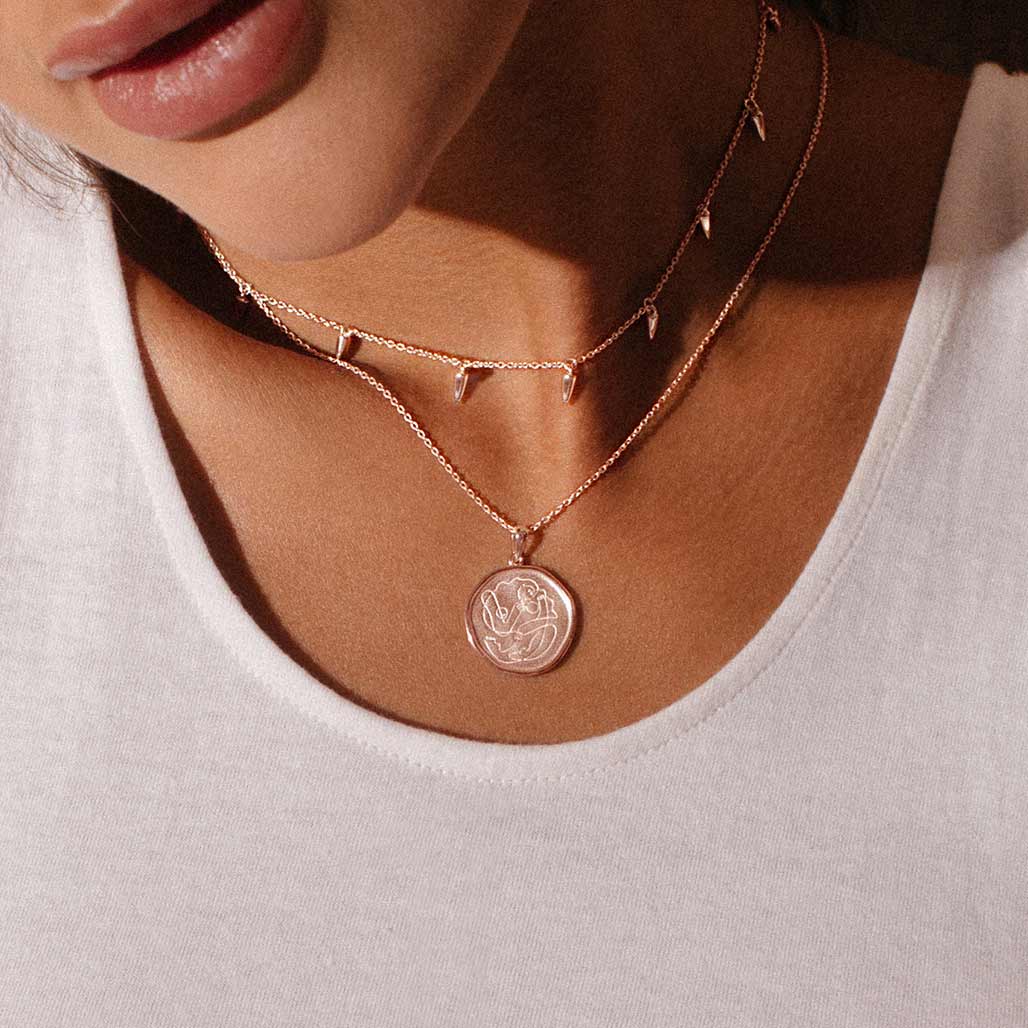 Handcrafted Rose Gold necklace celebrates the bond between mother and child. Artisan-made and intricately designed. 