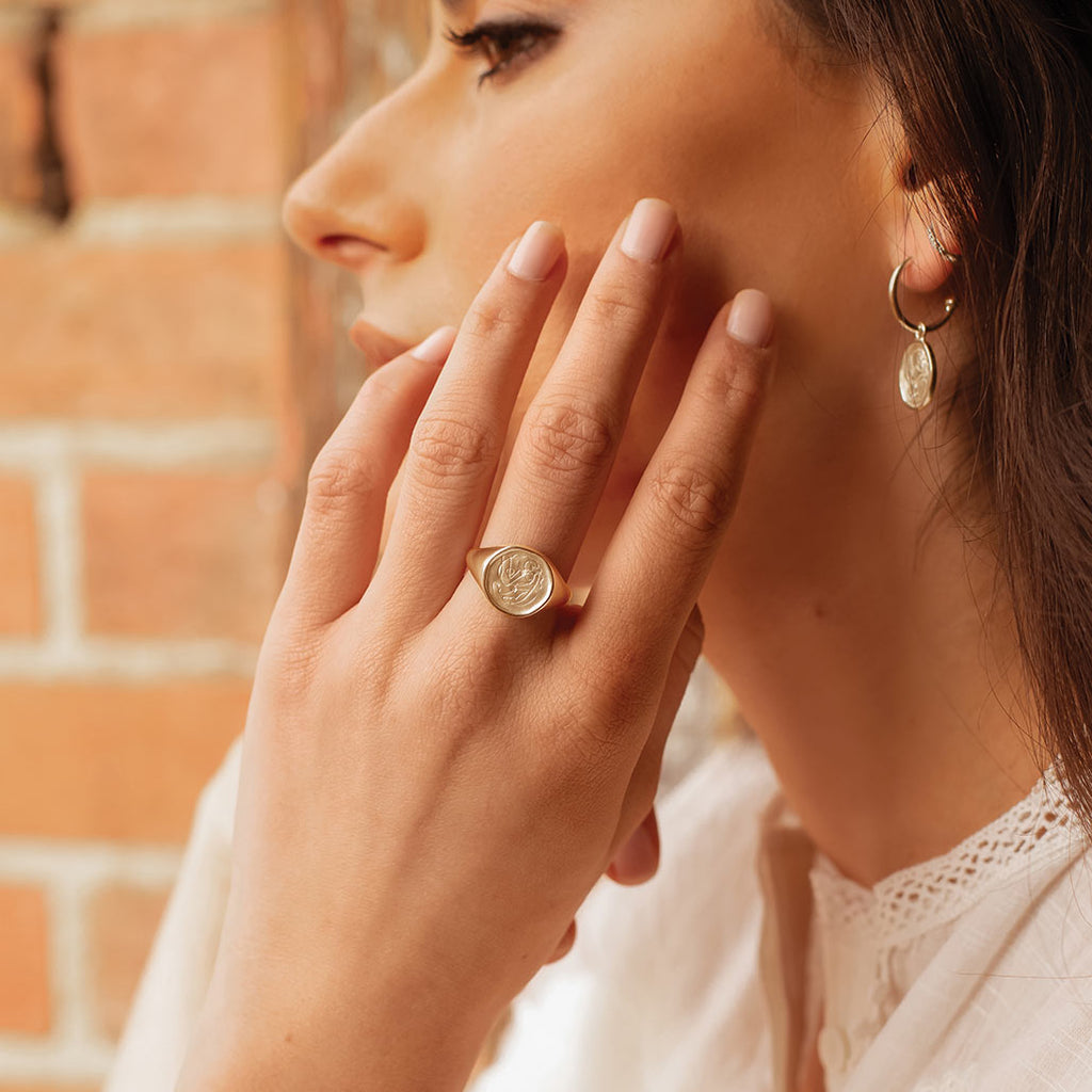 Handcrafted Gold ring celebrates the bond between mother and child. Artisan-made and intricately designed. 