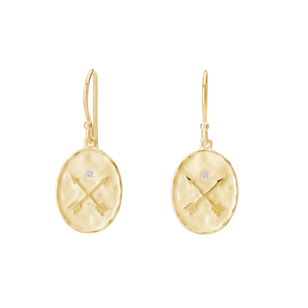 Oval-shaped earrings with intricate details. Crafted with love, these symbolic gold earrings showcase timeless beauty.