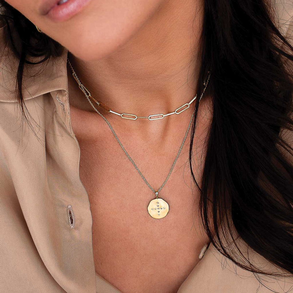 Gold necklace with modern ancient Ailm cross and white topaz. Originally designed and ethically made.