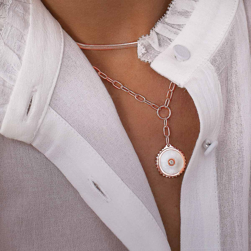 Meaningful rose gold drop necklace with ancient-inspired symbolism. Artisan-made with ethical production.