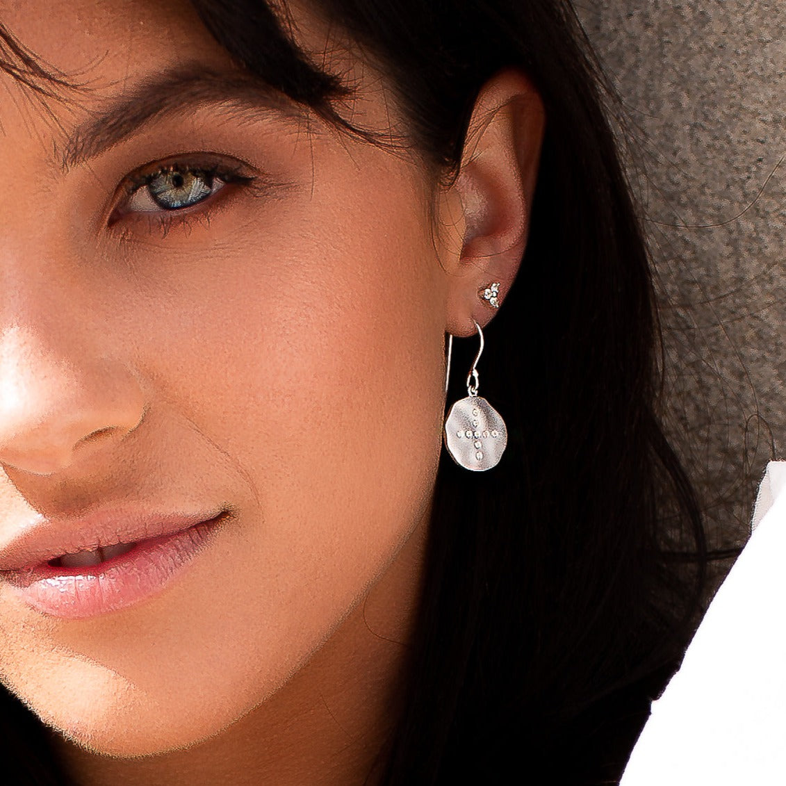 Ethically made artisan sterling silver hoop earrings with ancient symbolic meaning, inspiring confidence, and bravery. 