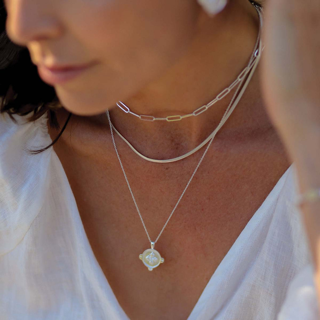 This ethical and handcrafted necklace offers a layered look for a trendy and versatile necklace layering style.